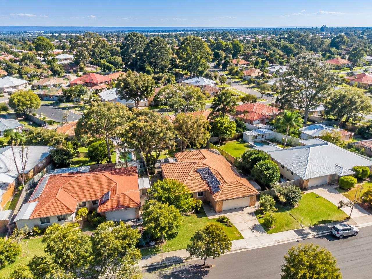 Aerial view of a leafy Australian suburb at dusk